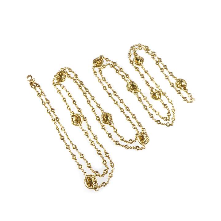 Antique gold longchain necklace with poppy motifs